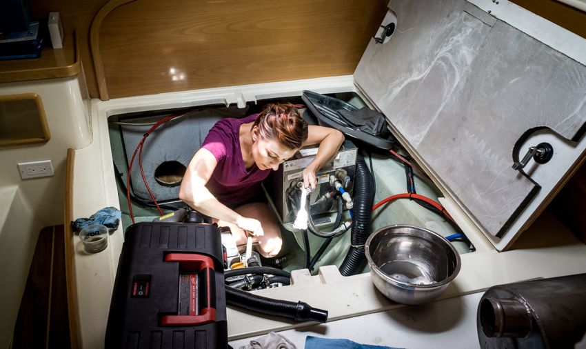 nikki wynn cleaning the sailboat engine