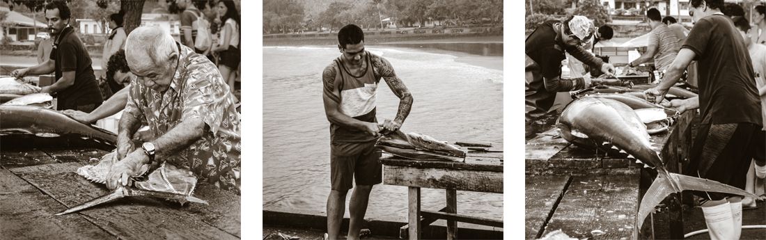 fishermen cleaning and filleting their catch Nuku Hiva Marquesas