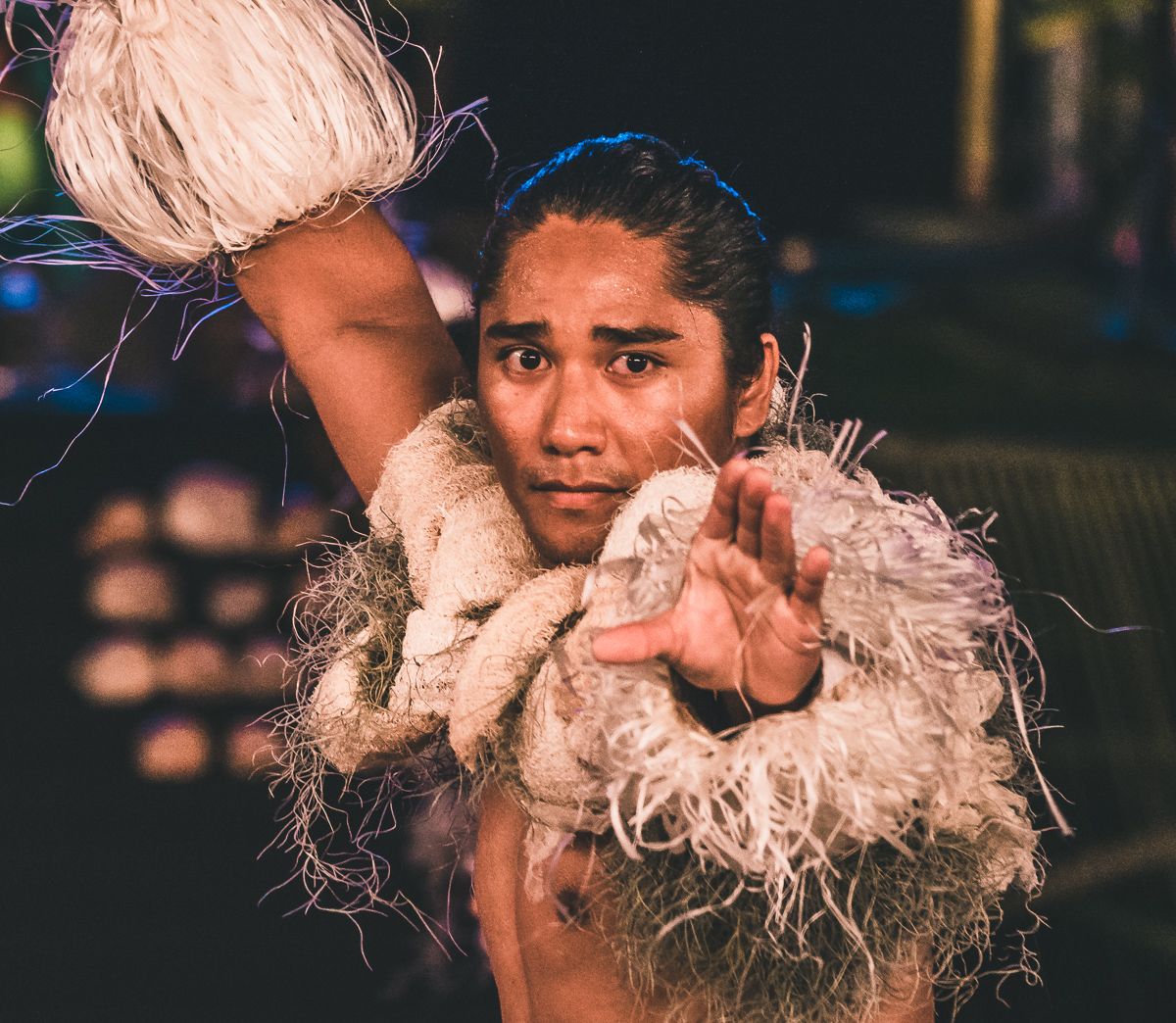beautiful tahitian man performing cultural dance
