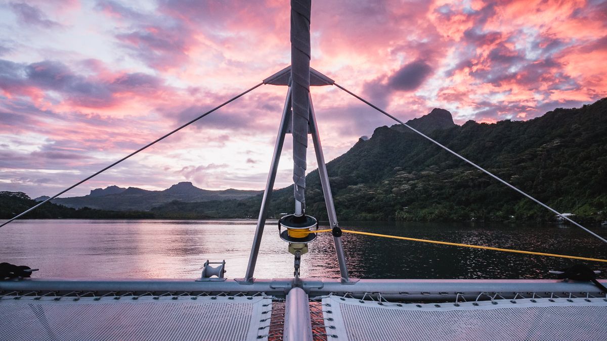 beautiful sunset at anchor on a catamaran in raiatea french polynesia