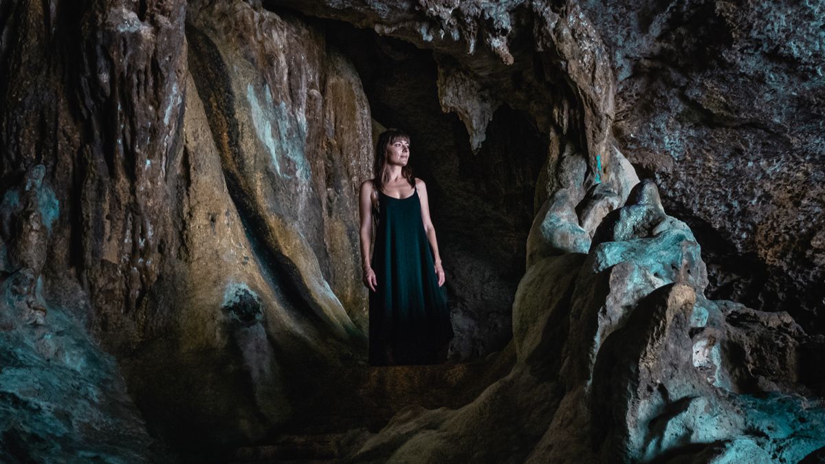nikki wynn exploring caves in Niue in the south pacific