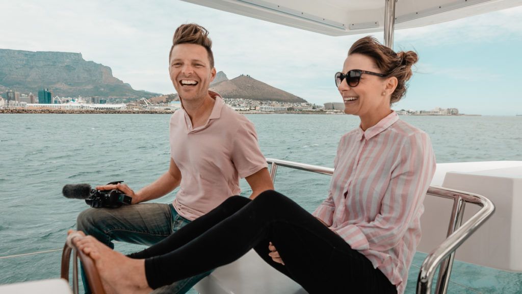 jason and nikki wynn at the helm of leopard catamaran in cape town south africa